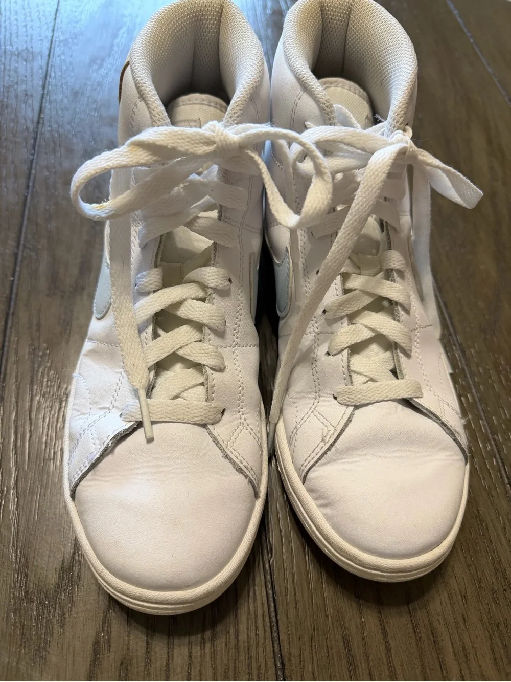 Nike White High-Top Sneakers with Light Blue Swoosh and Tan Heel Tab